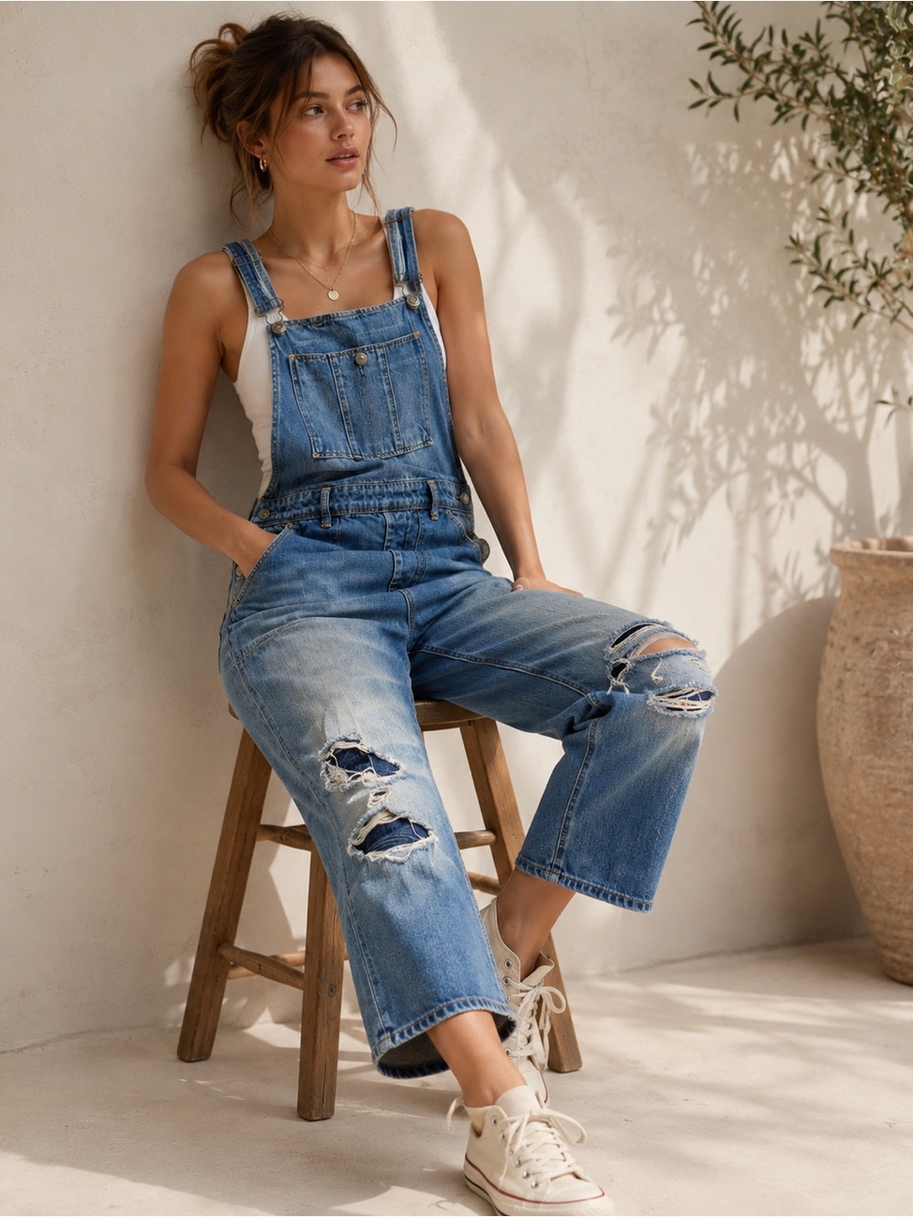 American Eagle distressed denim overalls in a relaxed cropped fit, size Medium